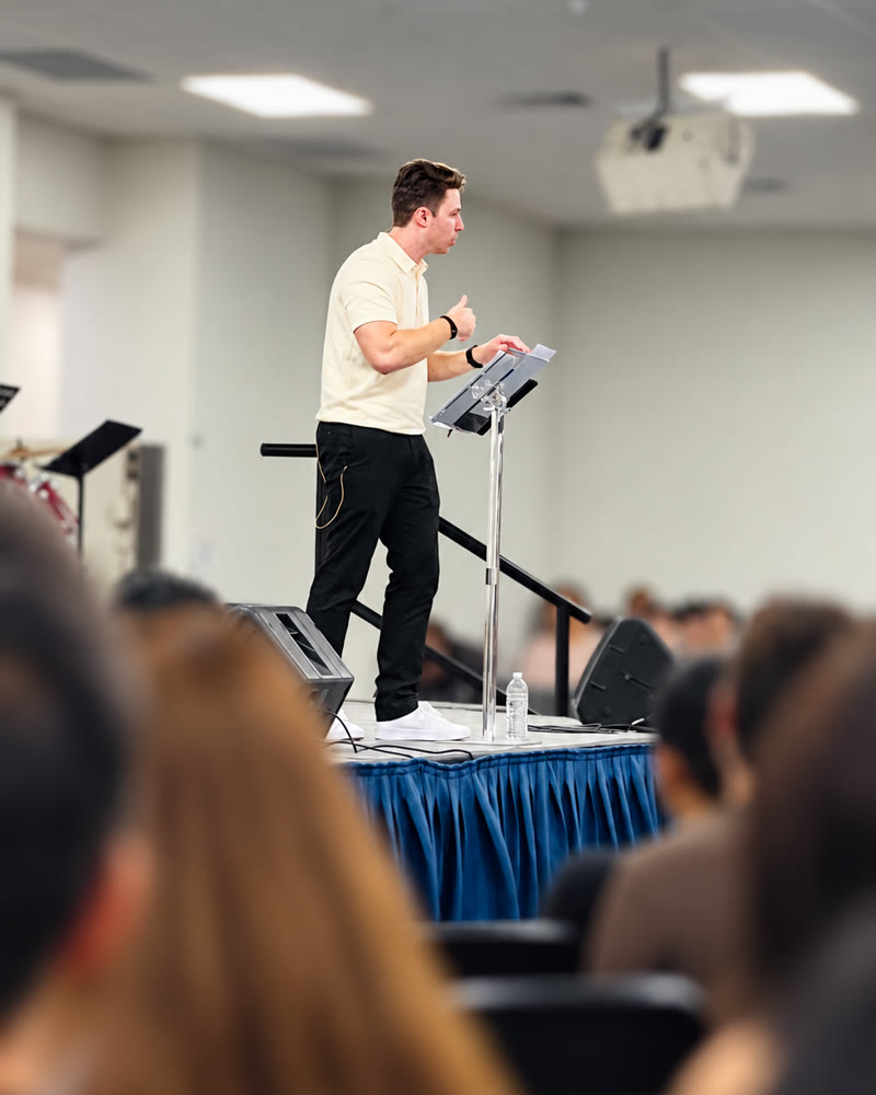 Jay Irwin speaking, side profile